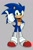 Size: 682x1024 | Tagged: safe, artist:scarlet stardust, sonic the hedgehog, clenched teeth, grey background, hand on hip, looking at viewer, male, signature, simple background, smile, solo, solo male, sonic boom (tv), standing, star (symbol), thumbs up, top surgery scars, trans boy sonic, trans male, transgender