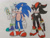 Size: 1032x774 | Tagged: dnp, safe, artist:theoneandonlycactus, shadow the hedgehog, silver the hedgehog, sonic the hedgehog, hedgehog, gun, male, pistol, traditional media, trio, weapon
