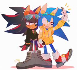 Size: 1280x1173 | Tagged: safe, artist:scuttletown, shadow the hedgehog, sonic the hedgehog, 2019, blushing, boots, charm, claws, clenched teeth, clothes, duo, ear piercing, earring, fingerless gloves, gay, holding hands, holding something, hoodie, jacket, lidded eyes, looking at camera, looking at viewer, phone, selfie, shadow x sonic, shipping, signature, simple background, smartphone, smile, standing, star (symbol), sunglasses, tongue out, white background, wink