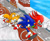 Size: 1024x836 | Tagged: safe, artist:sonicolas, knuckles the echidna, miles "tails" prower, sonic the hedgehog, sonic heroes, 2003, abstract background, daytime, from above, looking ahead, looking offscreen, no mouth, outdoors, running, seaside hill, spinning tails, team sonic, trio, water