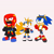 Size: 4200x4200 | Tagged: safe, artist:sour-sprite, knuckles the echidna, miles "tails" prower, sonic the hedgehog, echidna, fox, hedgehog, 2026, alternate outfit, alternate universe, apron, belt, cape, clothes, eyewear on head, flat colors, fully clothed, gloves, grey background, jacket, looking up, male, redesign, shirt, shoes, shorts, simple background, sketch, smile, standing, sunglasses, trio