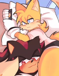 Size: 1577x2048 | Tagged: safe, artist:drawingwithjay1, miles "tails" prower, shadow the hedgehog, 2026, aged up, arm fluff, bed, between legs, clothes, duo, ear fluff, frown, gay, indoors, leg fluff, lidded eyes, looking at something, looking at viewer, lying down, lying on side, meme, phone, pillow, shadow x tails, shipping, shirt, shorts, smile